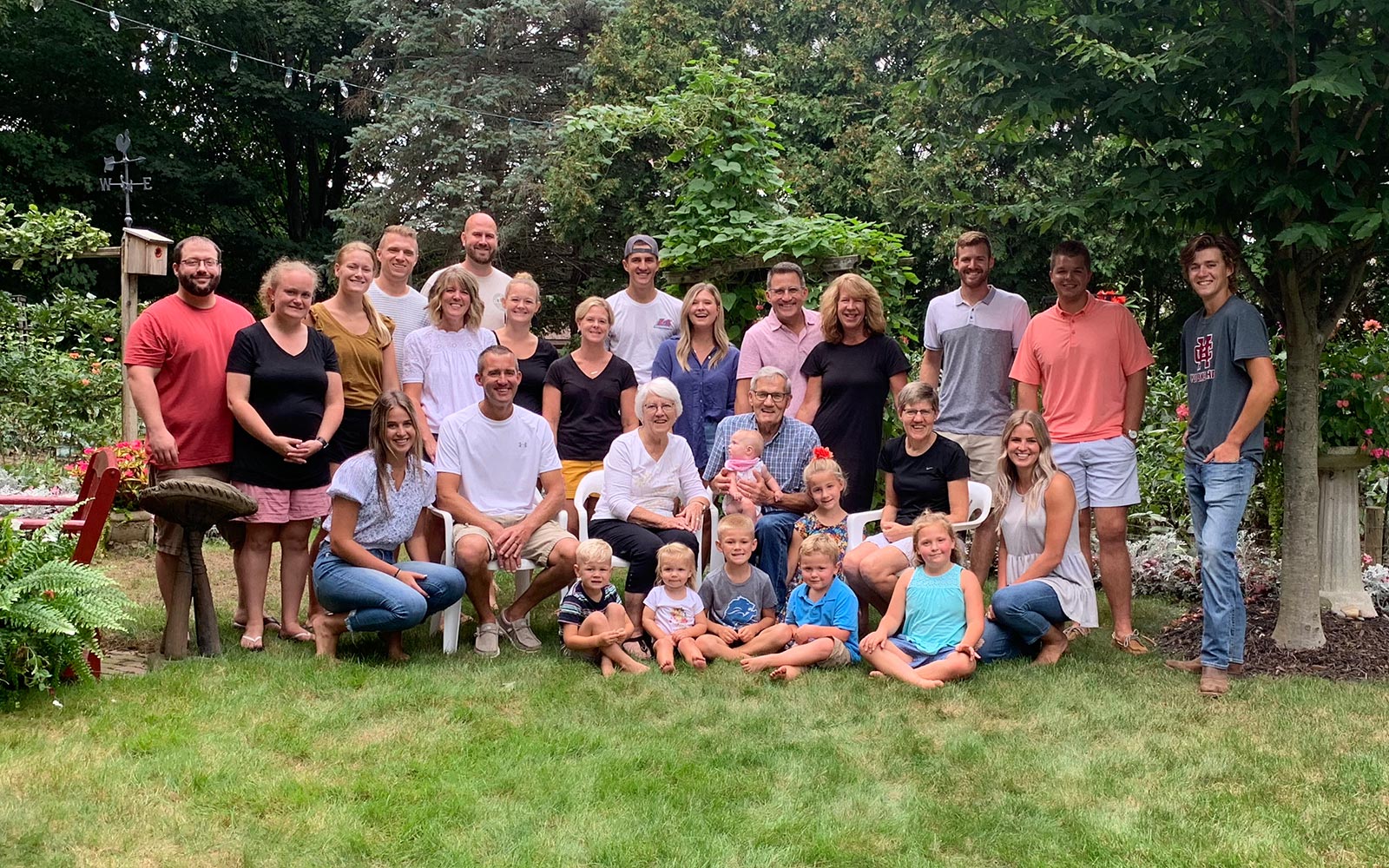 The four generation Slenk family sitting together outside