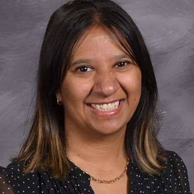 Dinah Pereira smiling at the camera