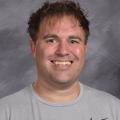 Micah Kool smiling at the camera