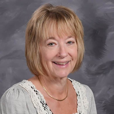 Janet Lynch smiling at the camera