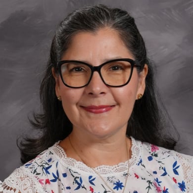 Floriselba Sanchez smiling at the camera.