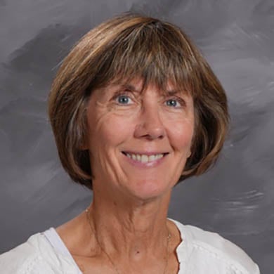 Diane Suigussaar smiling at the camera.