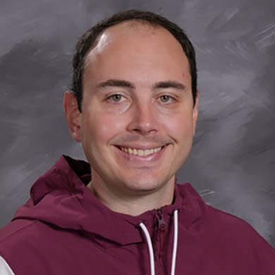 Ty VanWieren smiling at camera