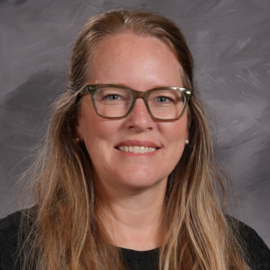 Susan VandenBerg smiling at the camera