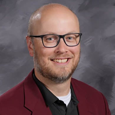 Andrew Kleyn smiling at the camera