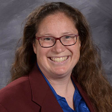Kim Hekman smiling at the camera.