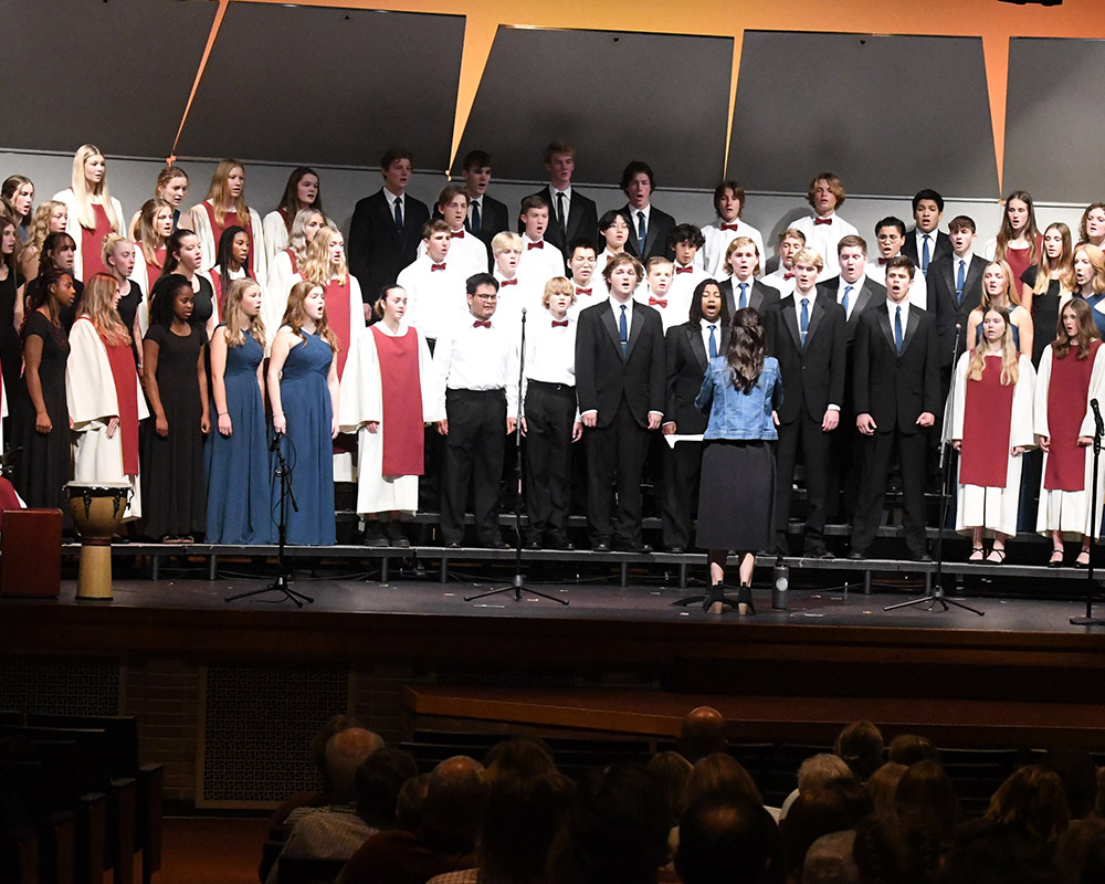 HCHS choirs all singing together in a performance directed by Mrs. Blom