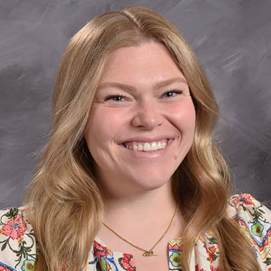 Mrs. Beukelman smiling at the camera