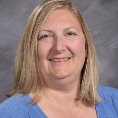 Michelle Hulst smiling at the camera.
