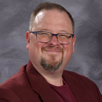 Lee Sytsma smiling at the camera