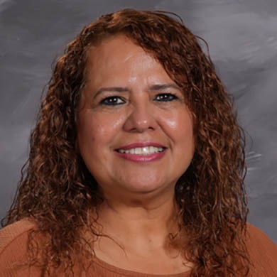 Aida Valdez smiling at the camera