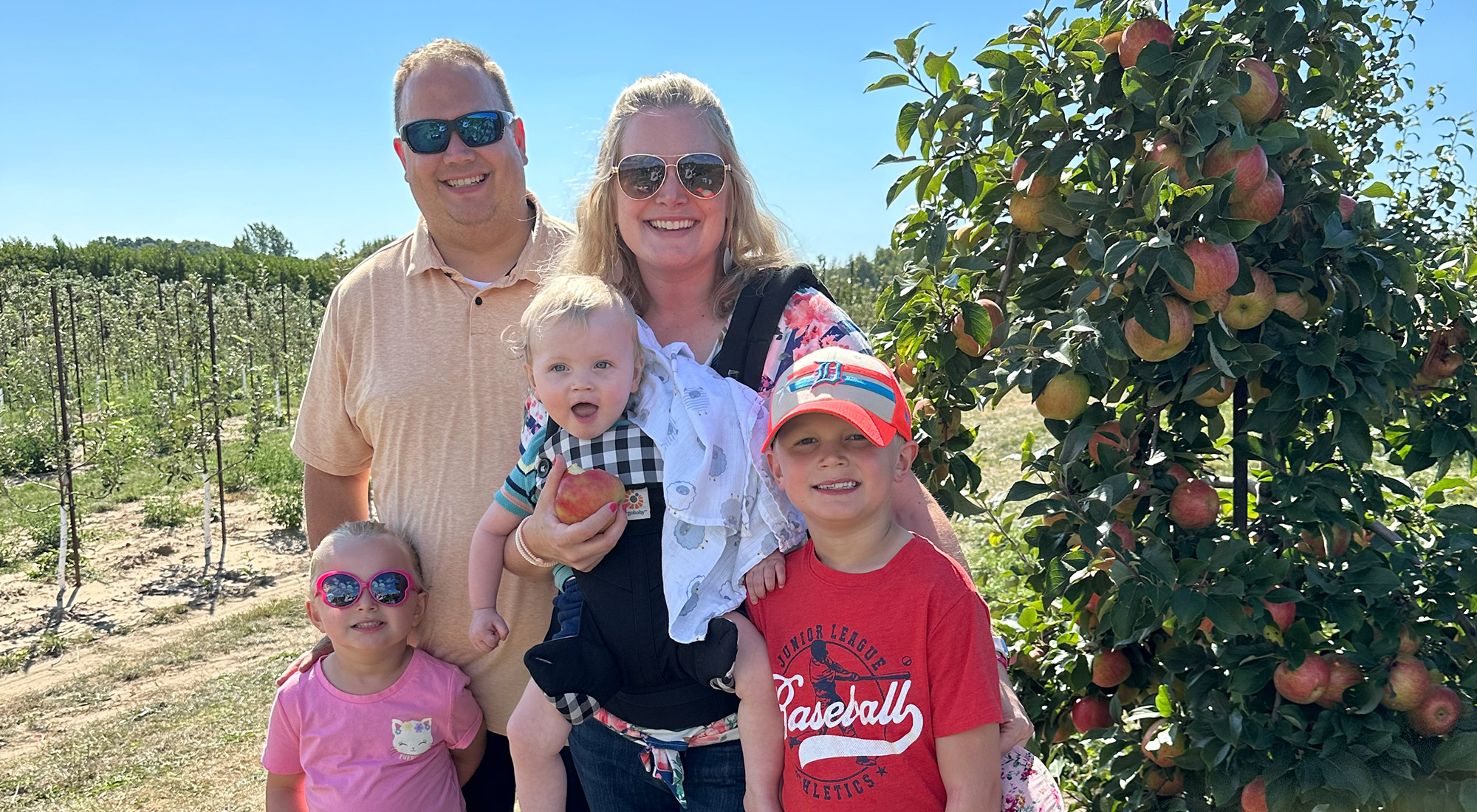 Becksfort family in an apple orchard
