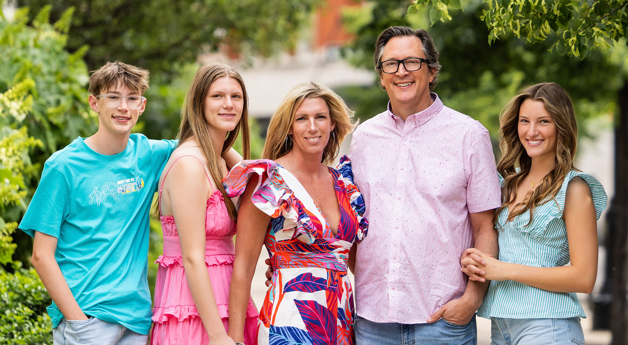 Five members of the Westerbeke family pose for a colorfu family portrait.