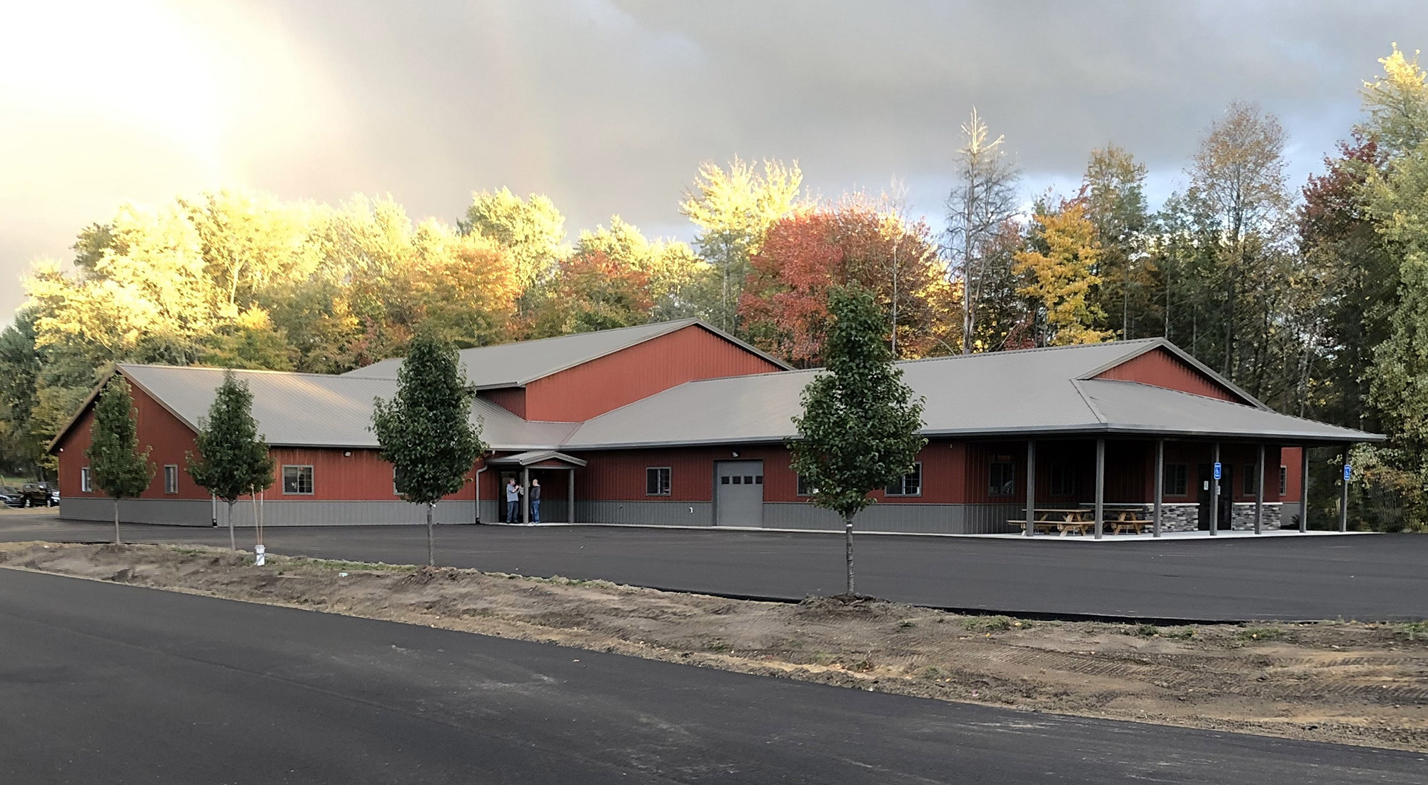 People Helping People building with trees behind it.