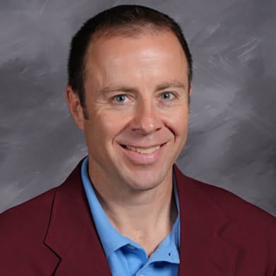 Joe Brunson smiling at the camera