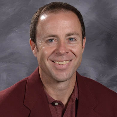 Joe Brunson smiling at the camera