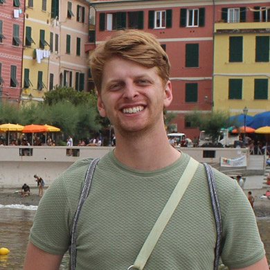 Sam Hofman smiling at the camera in Cinque Tiere.