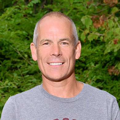 Coach Mulder smiling at the camera.