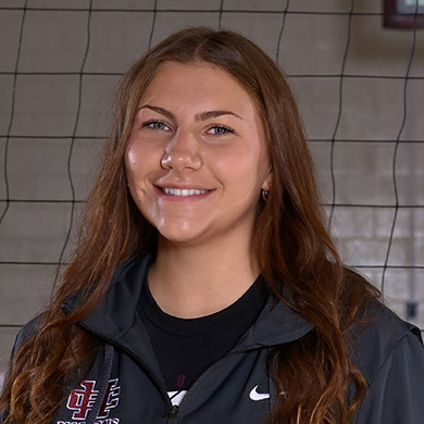 Coach Jarvie smiling at the camera.