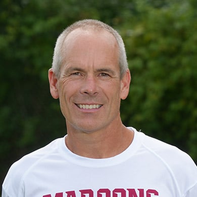 Coach Mulder smiling at the camera.