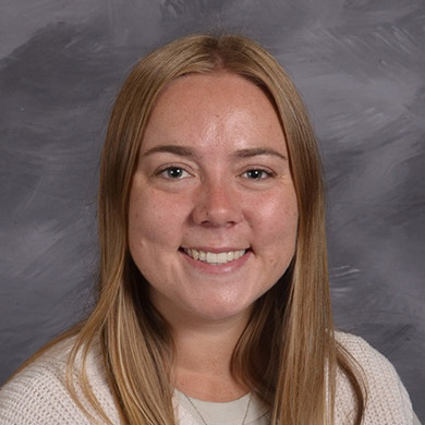 Bailey Spry smiling at the camera.