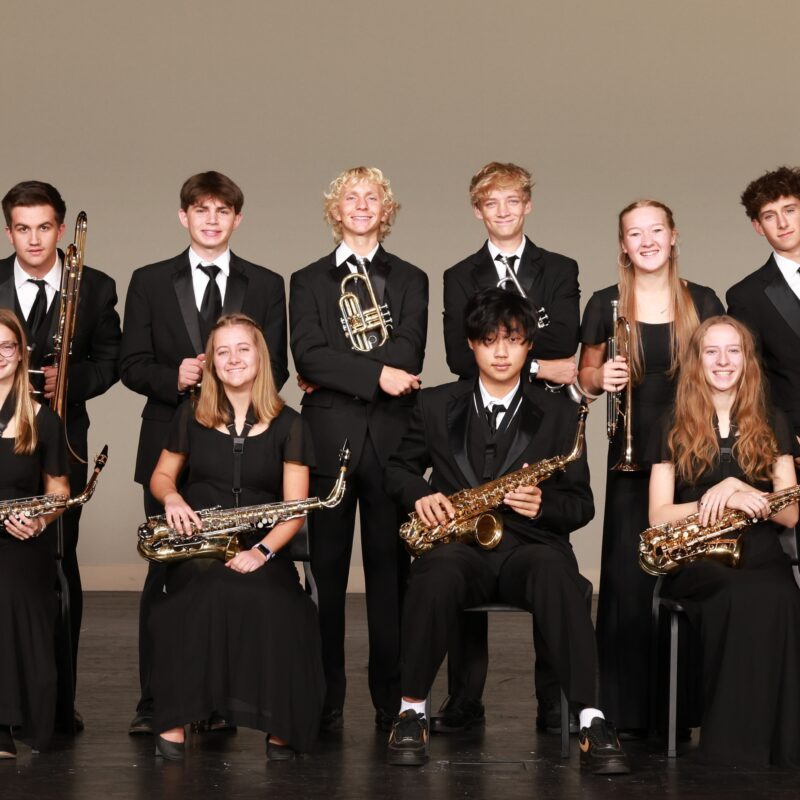 jazz orchestra smiling at the camera