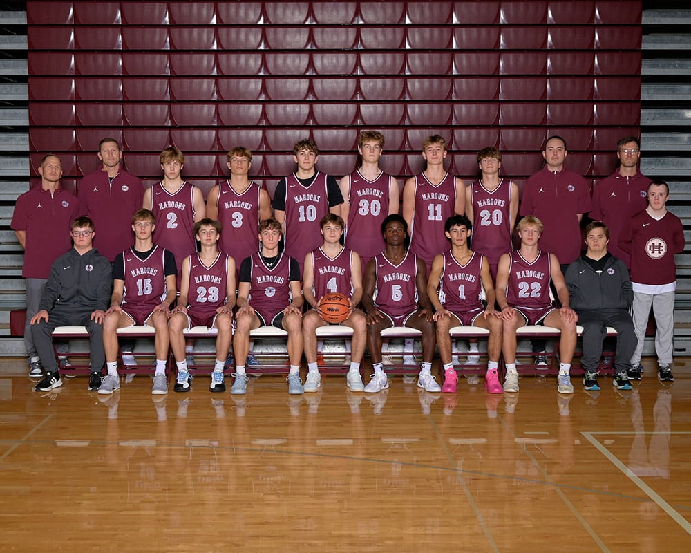Boys basketball team smiling at the camera