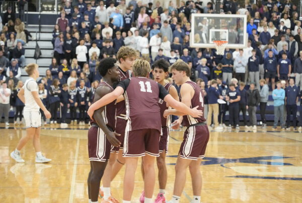 Boy's Varsity Basketball huddle