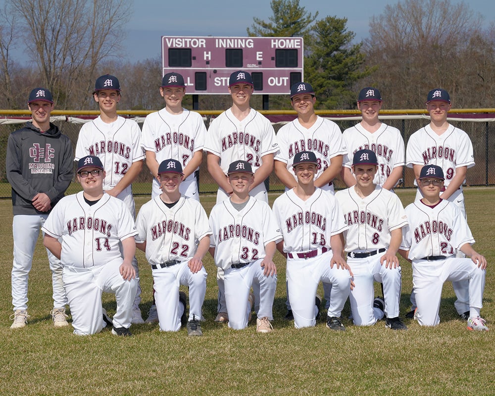 JV baseball team looking at the camera, outside
